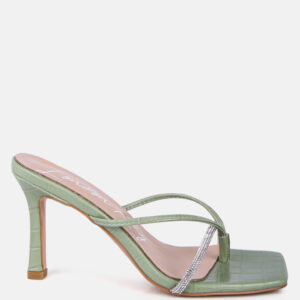 Mint green slide sandals with a crocodile texture and rhinestone embellishment on the strap.