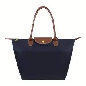 Navy blue tote bag featuring brown leather handles and a snap closure.