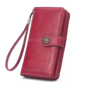 Red leather wallet with a wrist strap and decorative stitching.