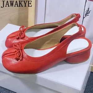 Pair of red slingback heels featuring a bow detail on the front and a low heel.