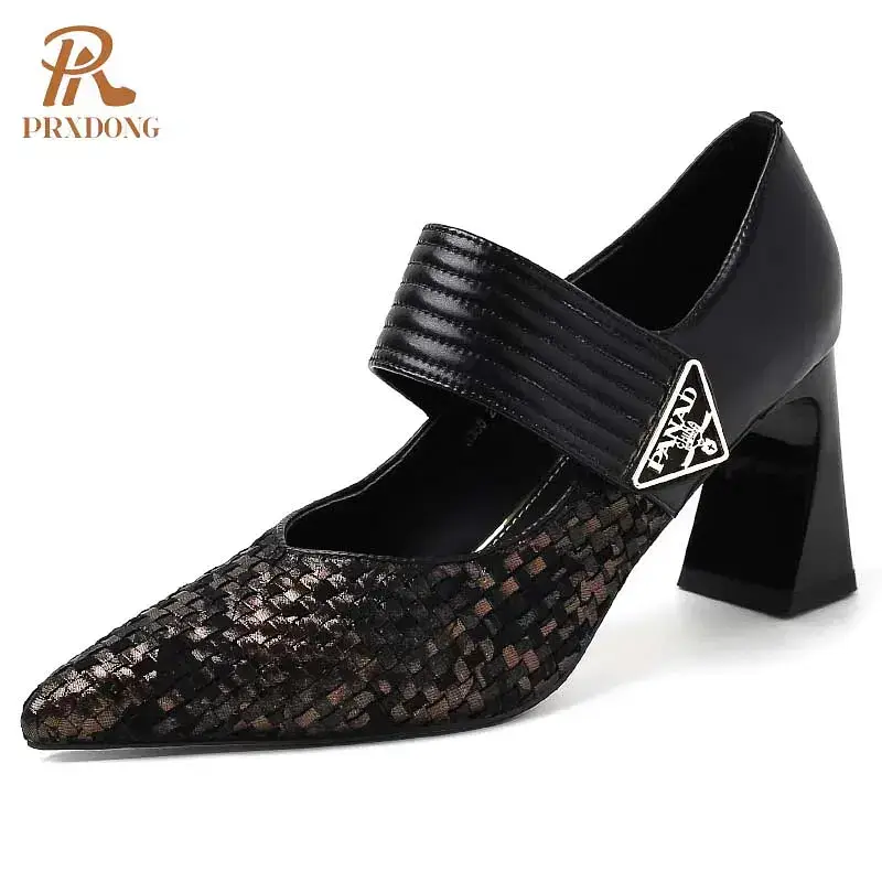 A high heel shoe featuring a woven design in black and brown. Black and brown woven high heel shoe with a wide strap and pointed toe design.