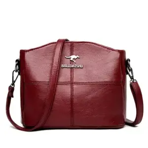 Maroon leather crossbody bag with a logo and adjustable strap.