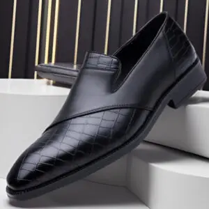 Black slip-on dress shoes featuring a textured design and smooth leather finish.